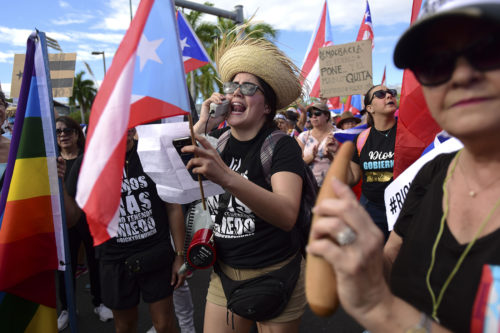 Demonstrators march on Las Americas highway demanding the resignation of governor Ricardo Rossello, in San Juan, Puerto Rico, Monday, July 22, 2019. Protesters are demanding Rossello step down for his involvement in a private chat in which he used profanities to describe an ex-New York City councilwoman and a federal control board overseeing the island's finance. AP Photo/Carlos Giusti