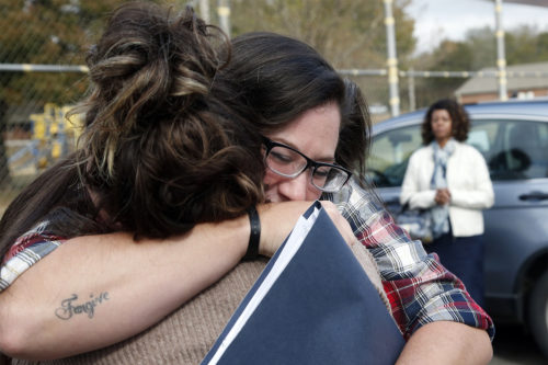 Danni Sloan Roberts, right, embraces her sister Sydney Roberts, left, after being released from the Eddie Warrior Correctional Center Monday, Nov. 4, 2019 in Taft, Oklahoma. More than 450 inmates walked out the doors of prisons across Oklahoma on Monday as part of what state officials say is the largest single-day mass commutation in U.S. history. AP Photo/Sue Ogrocki