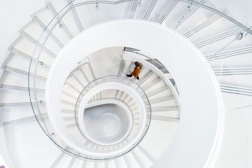  A student walks down the spiral staircase in ISEC. Photo by Adam Glanzman/Northeastern University