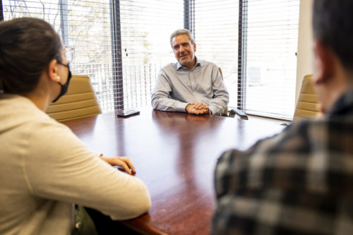 Walter Frankel talks with members of his team at Clearhaven recovery center in Waltham, Massachusetts on Jan. 25, 2022.