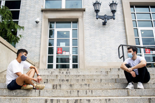 Students socialize from a safe distance on Northeastern’s Boston campus. Photo by Ruby Wallau/Northeastern University