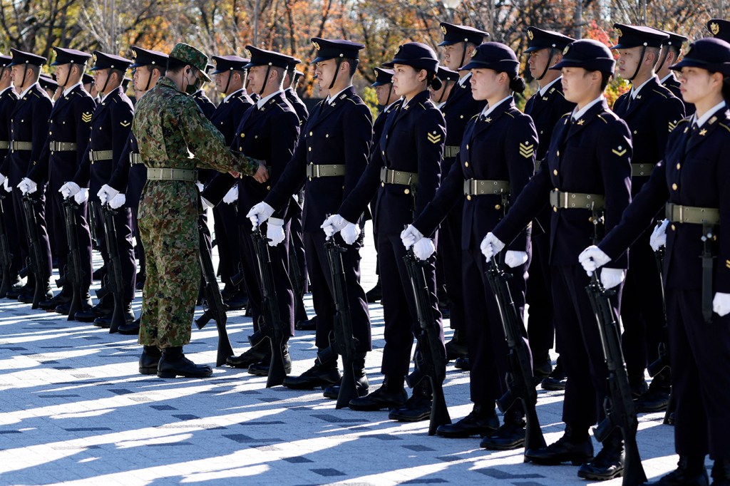 Members of the Japan Ground Self-Defense Force (JGSDF) prepare ahead of an honour guard during a review at JGSDF Camp Asaka in Tokyo.