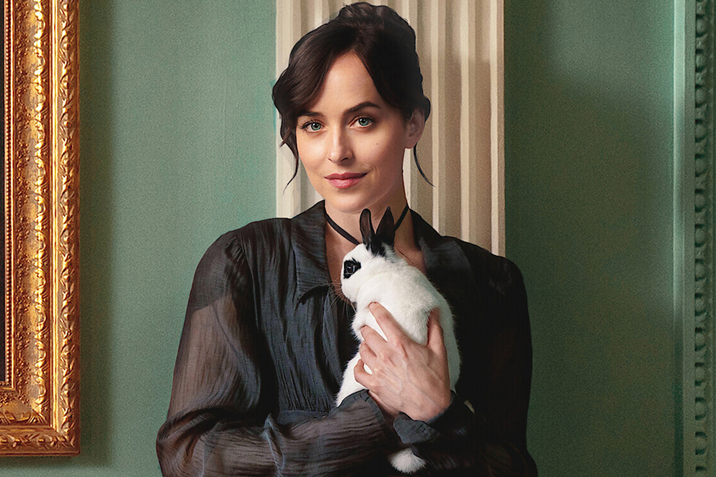 Dakota Johnson as Anne Elliot, holding a black and white rabbit.