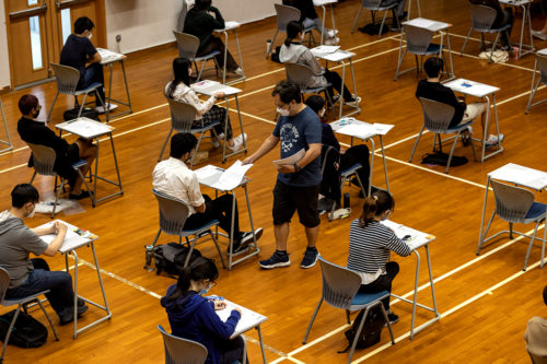 students sitting in desks in a row