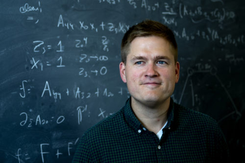 James Halverson, an assistant professor of physics in the College of Science, uses artificial intelligence to untangle knots and uncover the secrets of the universe. Photo by Matthew Modoono/Northeastern University