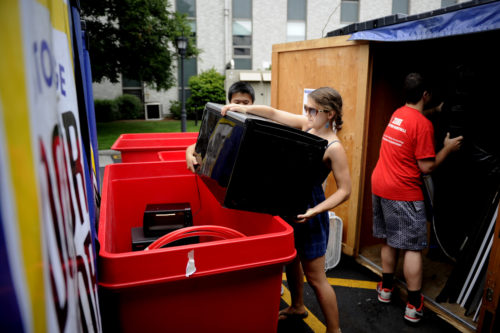 Aug. 31, 2016 - BOSTON, MA. - Michael Shen, S'19, Marley Arborico, S'19, and Zachary Marcus, E'19, prepare for the Trash to Treasure event outside the Curry Student Center at Northeastern University on Aug. 31, 2016.  Photo by Matthew Modoono/Northeastern University