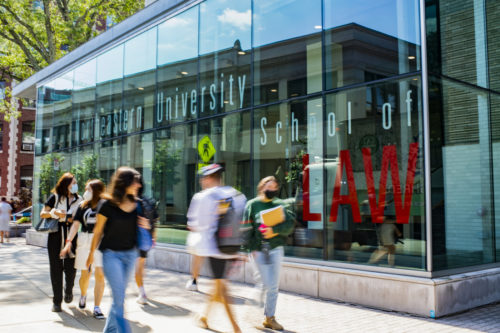 students walk by northeastern’s top rated law school
