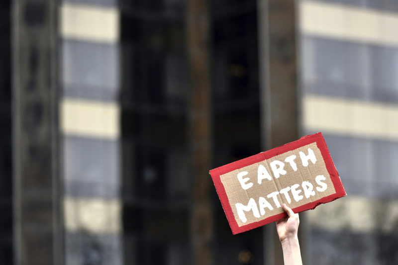 A protestor holds up a sign during the U.S. Youth Climate Strike at Columbus Circle in New York on March 15, 2019. AP Photo by Anthony Behar/Sipa USA