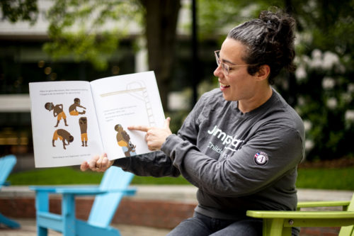 Lisa Gozbekian, a site member for the Jumpstart branch for Northeastern, reads from a children’s book. Jumpstart distributes reading materials to preschoolers so they aren't behind when starting kindergarten. Photo by Ruby Wallau/Northeastern University