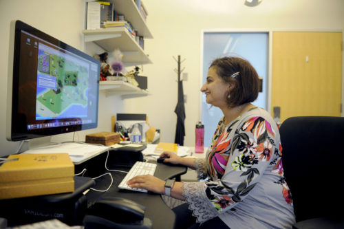 09/08/15 - BOSTON, MA. -  Magy Seif El-Nasr, associate professor with joint appointments in the College of Computer and Information Science and the College of Arts, Media and Design works in her office at Northeastern University on Sept. 8 2016. Photo by: Matthew Modoono/Northeastern University