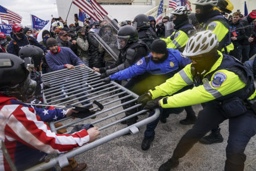 A survey taken after the one-year anniversary of the Jan. 6, 2021, attempted takeover of the U.S. Capitol finds that 23 percent of the U.S. believe that violent protest against the government is justifiable. The feeling was shared almost equally between liberals and conservatives. AP Photo/John Minchillo
