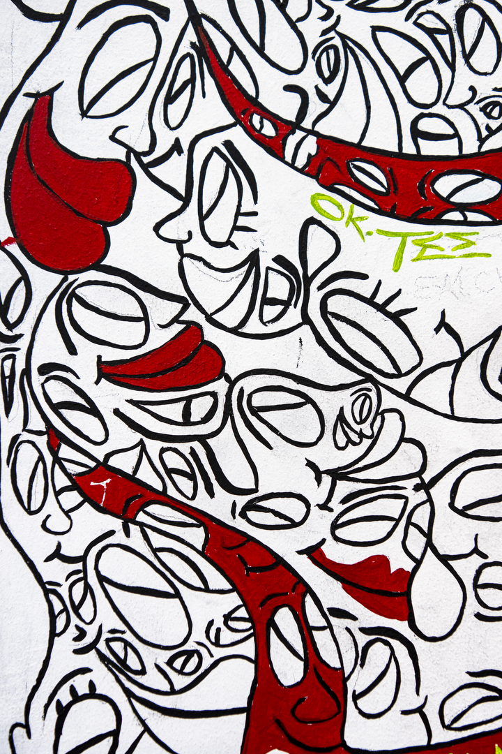 Smiling faces, seemingly growing on top of one another