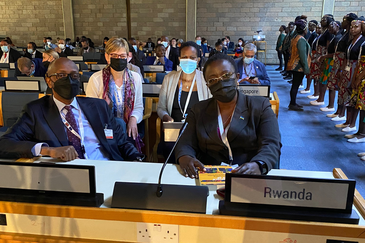 Four people sitting at Rwanda delegation table for the U.N. 