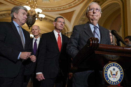 Senate Minority Leader Mitch McConnell, R-Ky., right, joined by from left, Sen. Roy Blunt, R-Mo., Sen. Rick Scott, R-Fla., Sen. John Barrasso, and Sen. Joni Ernst, R-Iowa, pauses as he speaks during a news conference on Capitol Hill in Washington. AP Photo/Carolyn Kaster