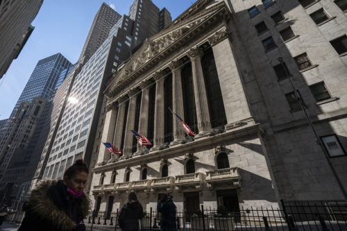 Pedestrians walk past the New York Stock Exchange. Stocks have fallen sharply so far this year as the market readies for the Federal Reserve to raise interest rates to try to tame inflation, which is at its highest level in nearly four decades. AP Photo/John Minchillo