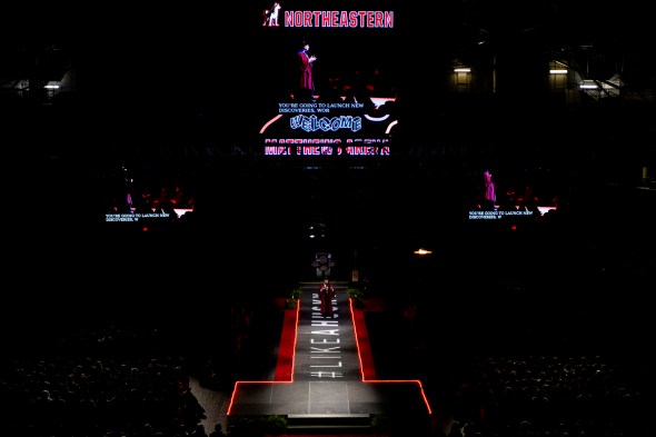 A large stage is dimly lite at Northeastern's 2022 Convocation. 