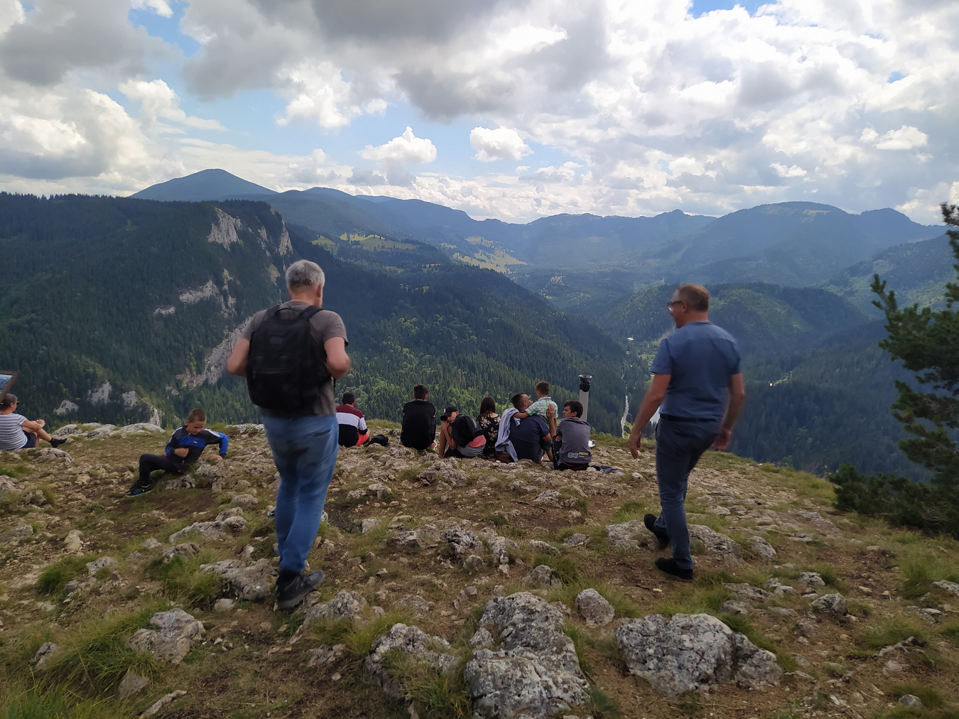 People are hiking during their camping trip in Transylvania.