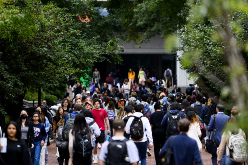 Northeastern students walk though campus during class break on Monday. Photo by Matthew Modoono/Northeastern University