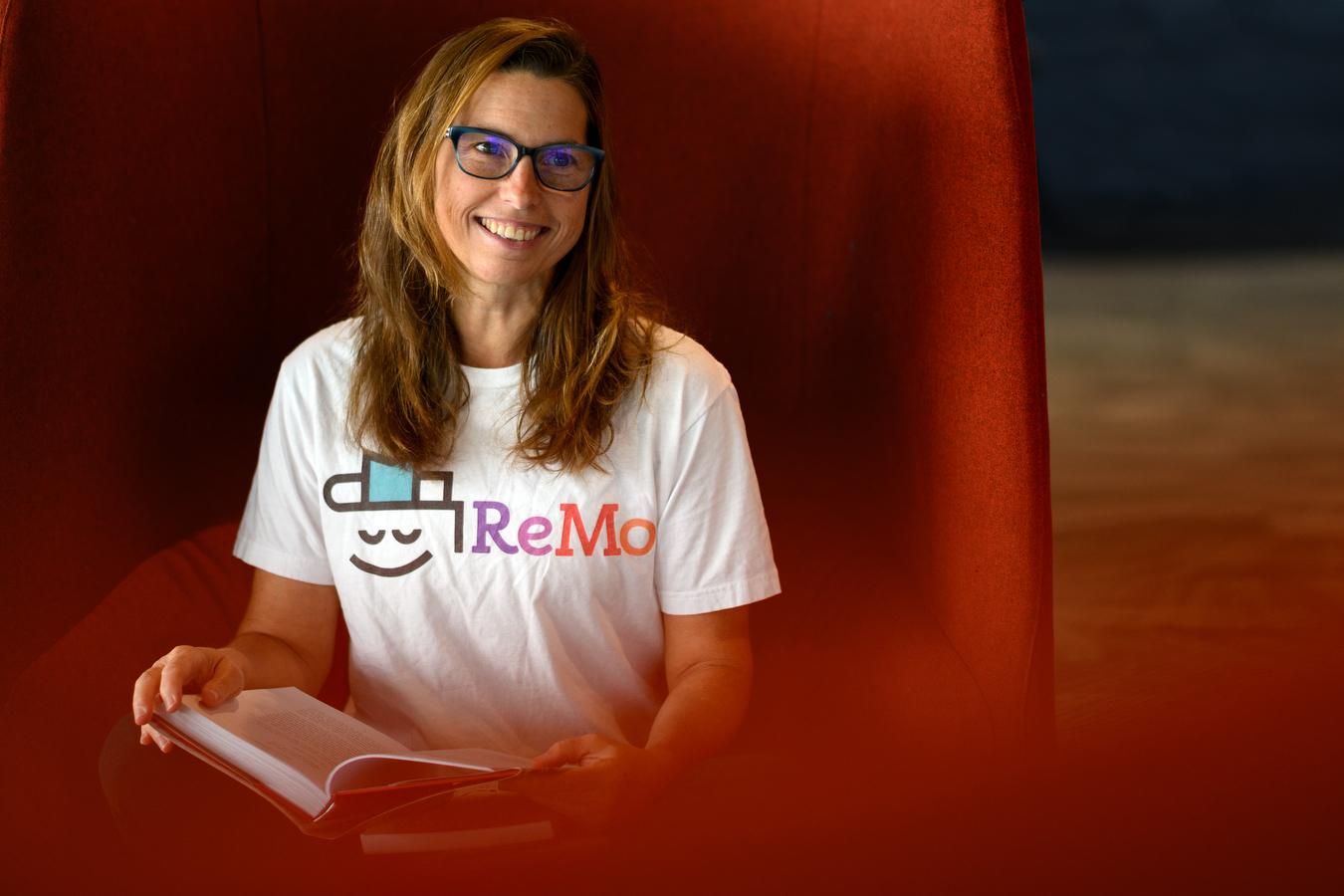 michelle deblois smiling wearing shirt with ReMo logo on it