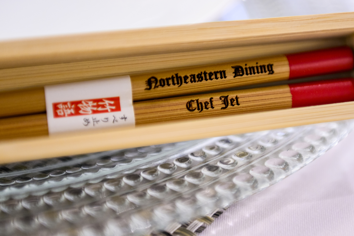 chopsticks with chef tila's name engraved on them