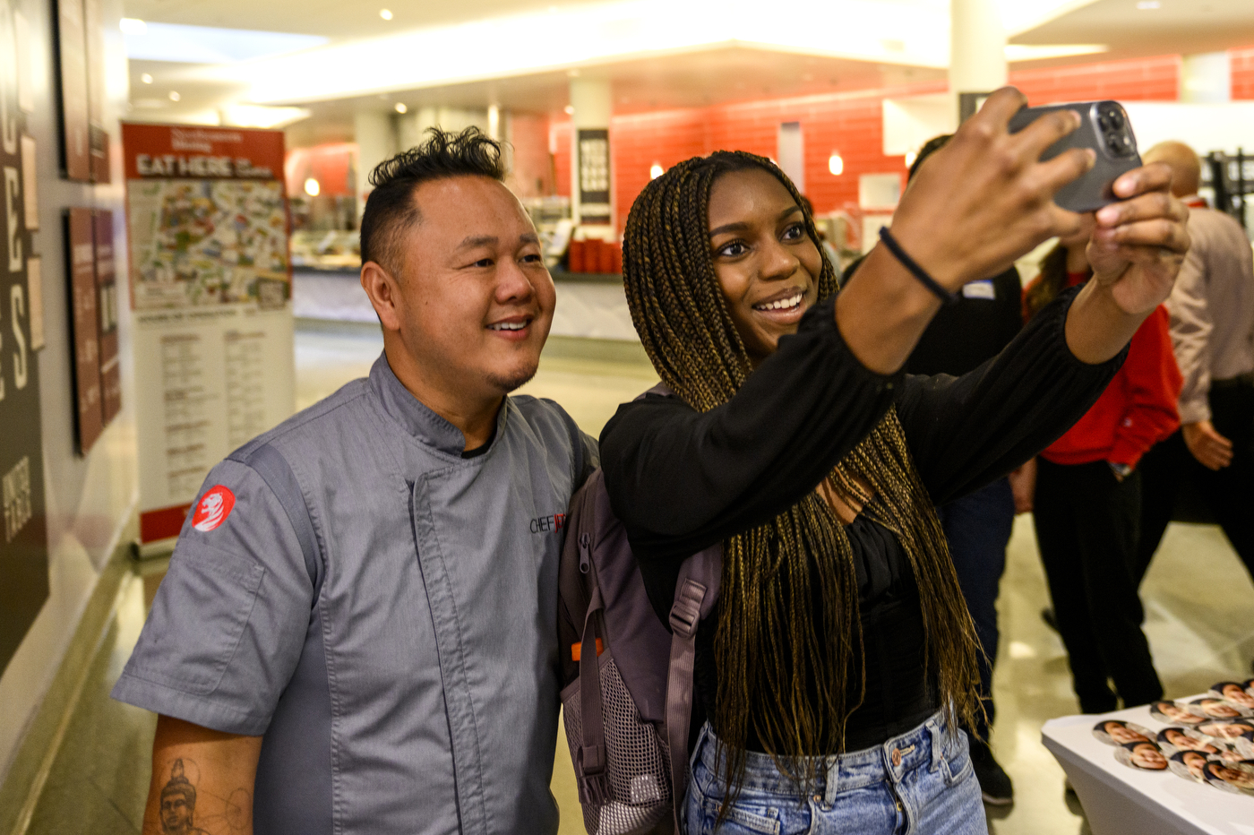 chef tila taking selfie with a student