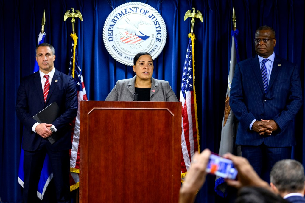 rachael rollins standing at the front of a press conference