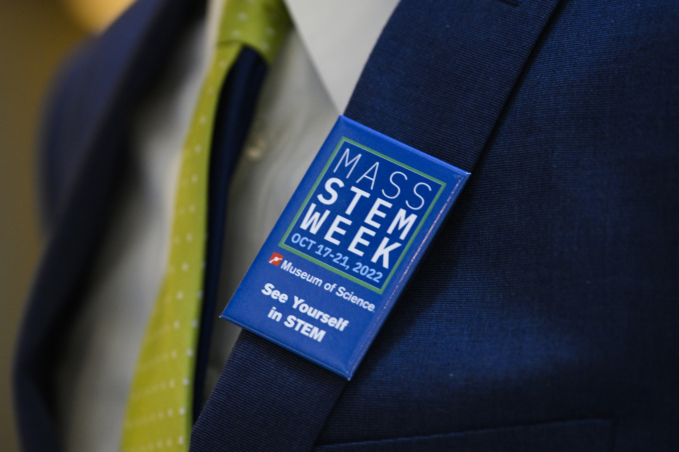 A blue pin is displayed with white text" "MASS STEM Week 2022."