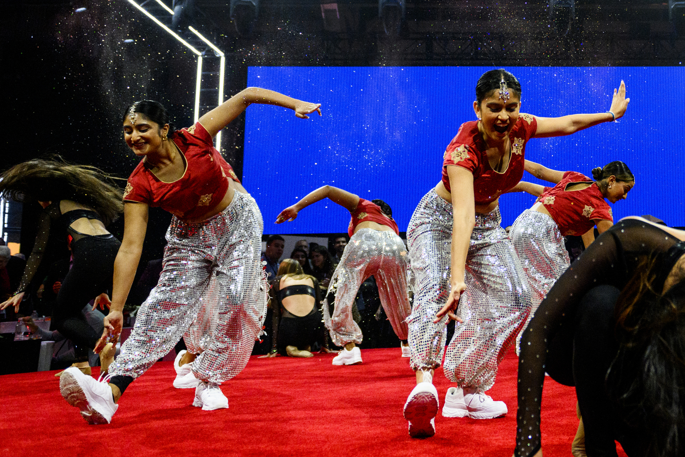 Dancers perform on stage