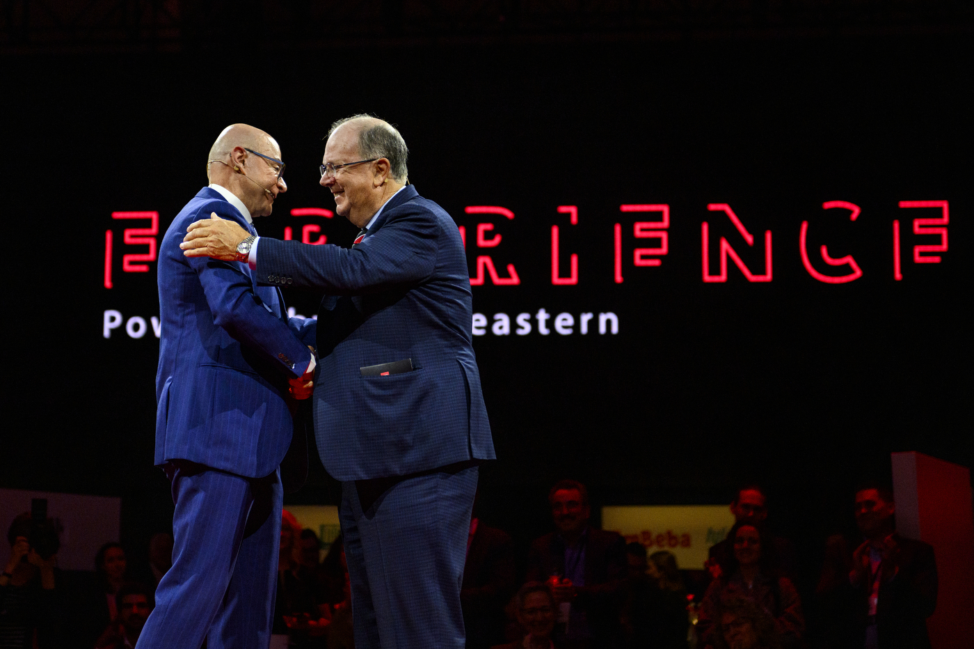 alan mckim and president aoun shaking hands