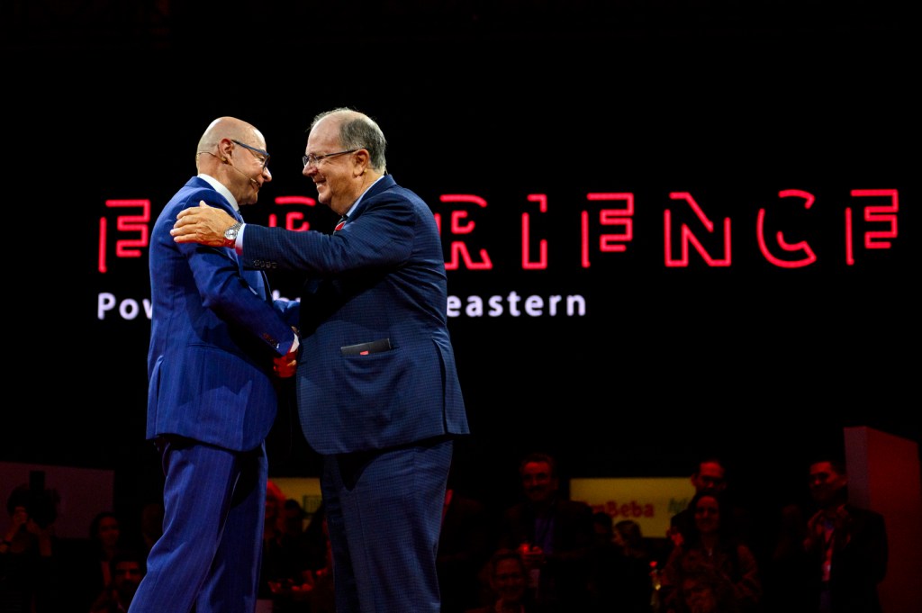alan mckim and president aoun shaking hands