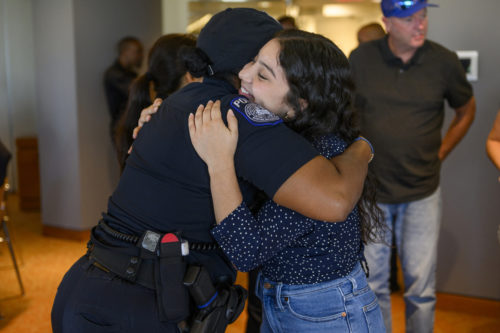 NUPD and LAPD officers welcome Torch Scholar Celeste Garnica, right, to Northeastern during a celebratory brunch held in the Alumni Lounge last week. Photo by Matthew Modoono/Northeastern University