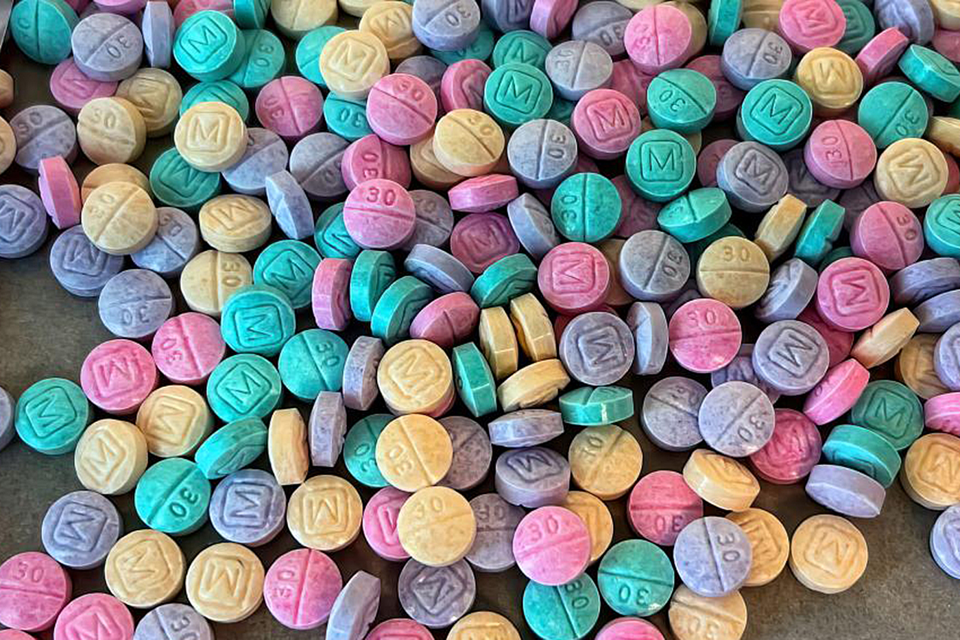 Rainbow fentanyl pills all splayed out