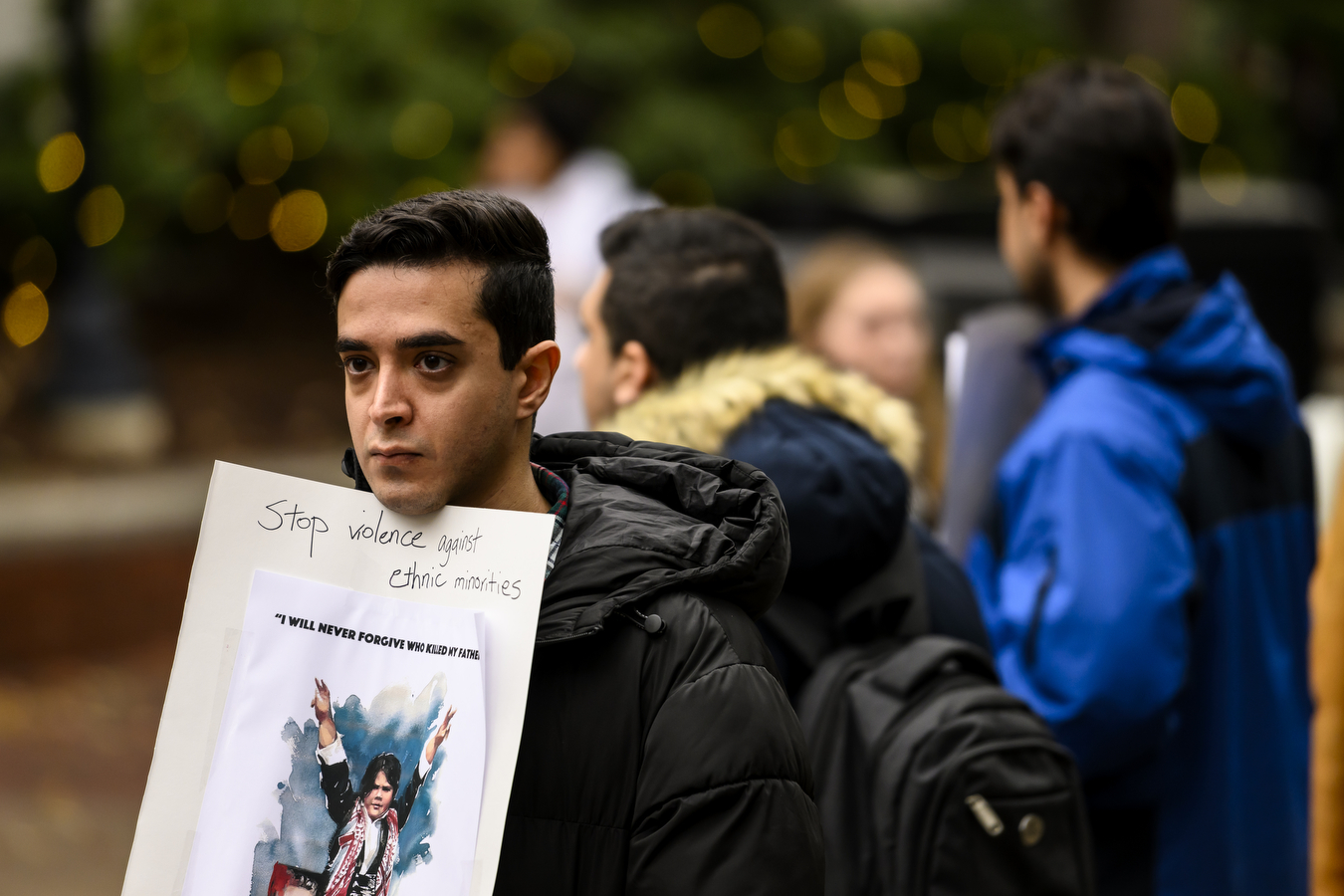 student holding Iran protest sign