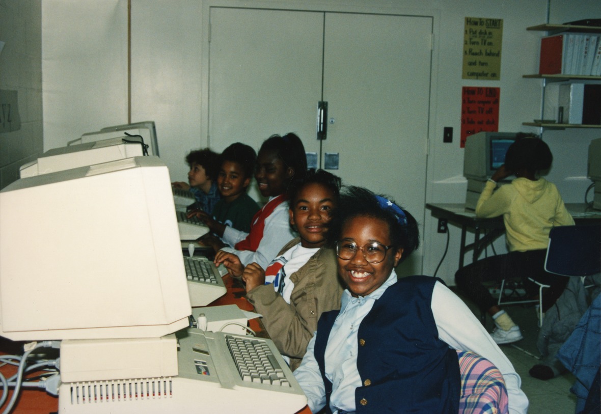 young students posing in a computer lab