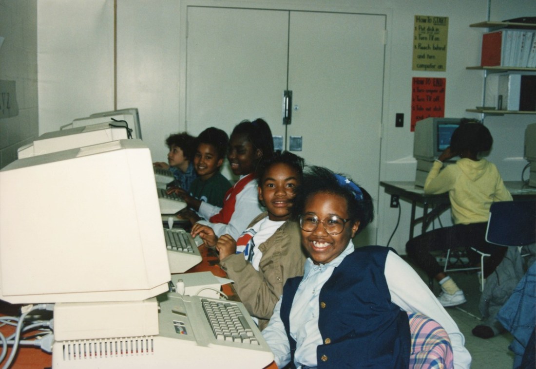 young students posing in a computer lab