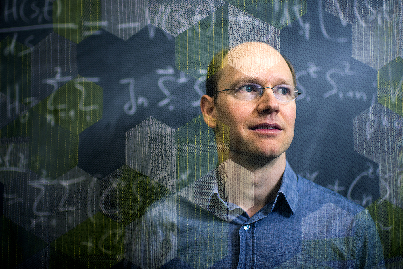 Headshot of Gregory Fiete, overlaid by equations and hexagons