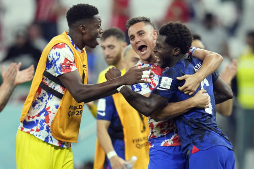 United States' Yunus Musah, right, Aaron Long, center, and United States' goalkeeper Sean Johnson celebrate after defeating Iran in the World Cup group B soccer match between Iran and the United States at the Al Thumama Stadium in Doha, Qatar. AP Photo/Ashley Landis
