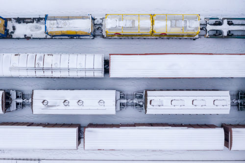 aerial photo of trains in a line