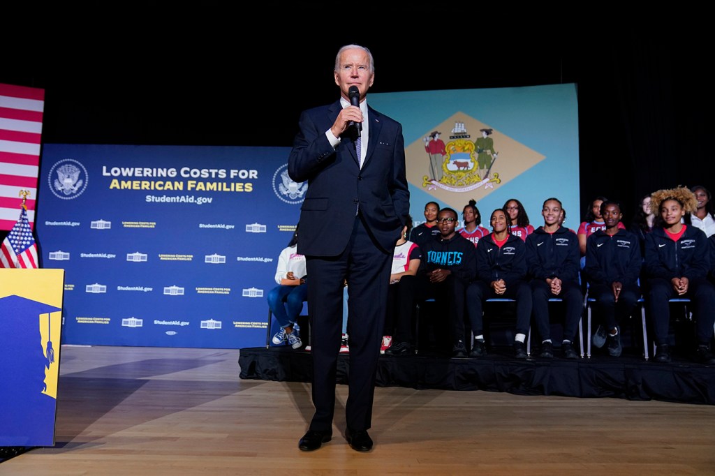 president biden speaking into a microphone at delaware state university