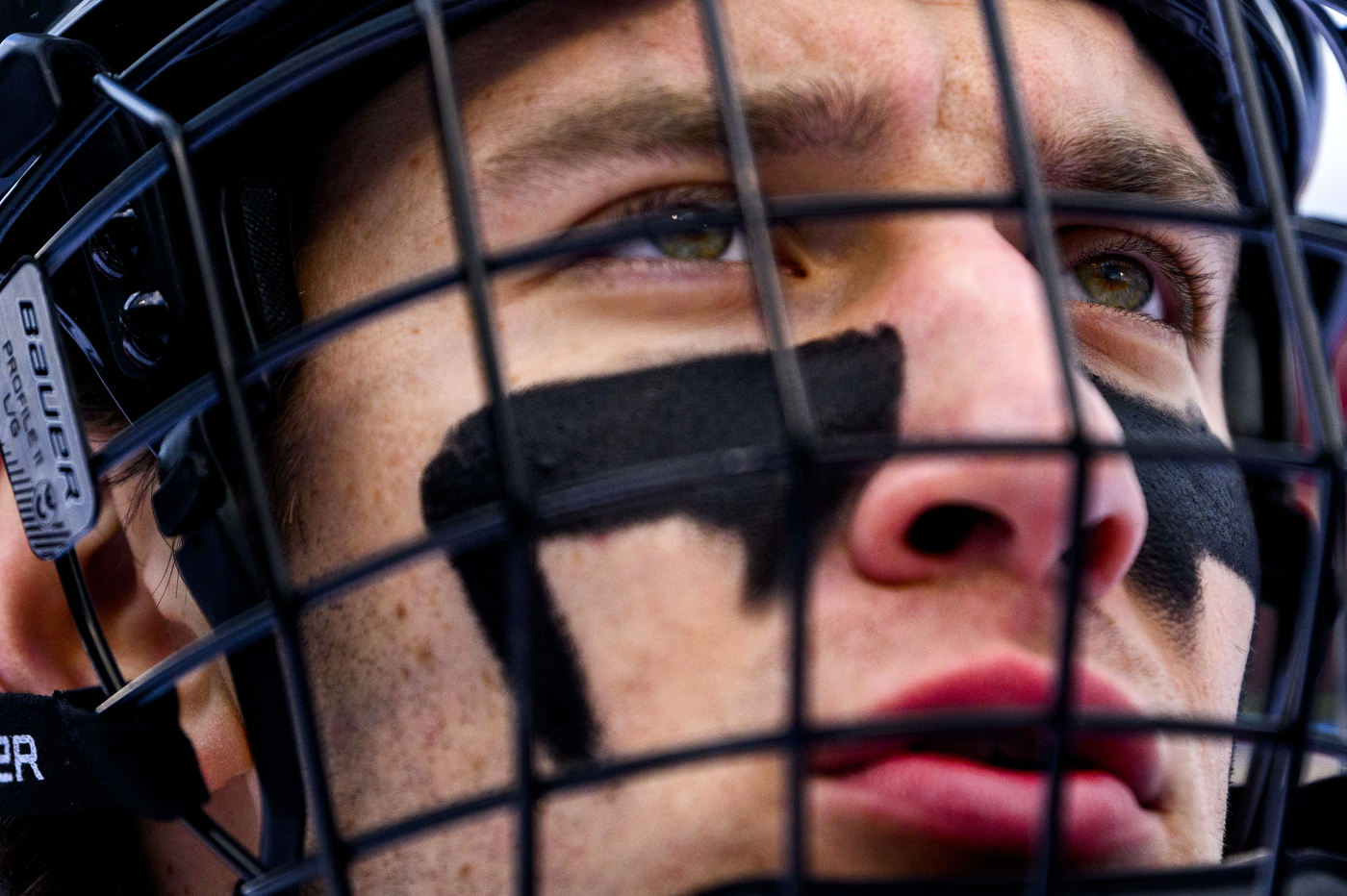 A close-up image of a hockey player's face. 