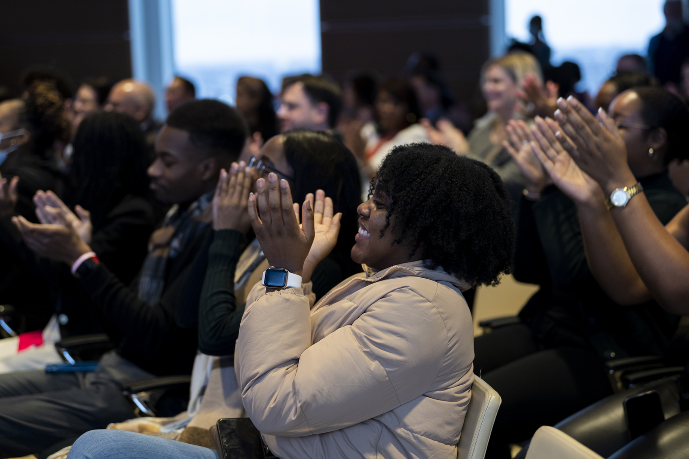 A group of people sits in the audience of Northeastern's celebration of Martin Luther King Jr.