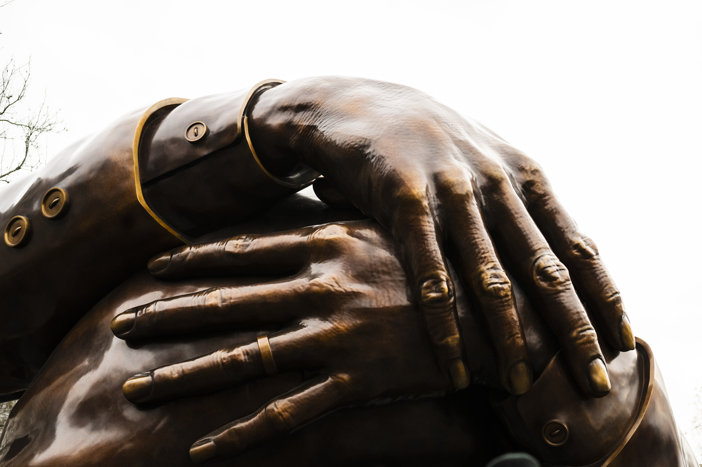 a close up picture of the hands featured on the embrace statue