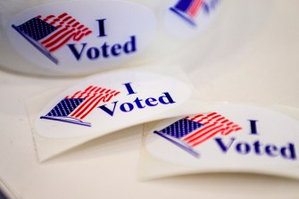 'i voted' stickers on a white table