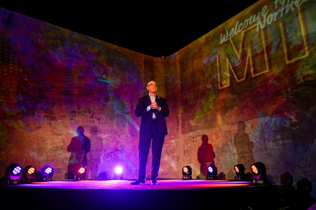 Northeastern University President Joseph E. Aoun stands on a stage