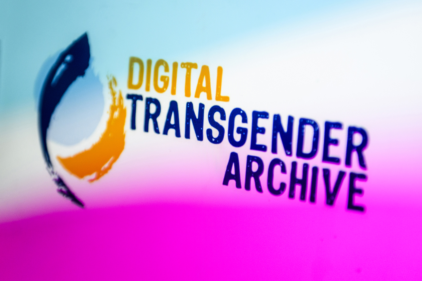 A multi-colored graphic with orange and blue text: "Digital Transgender Archive."