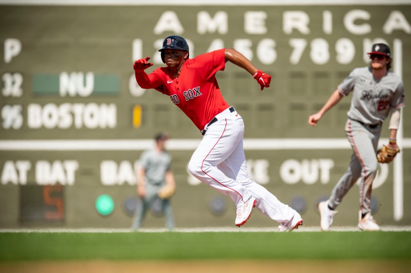 A red sox player runs the bases 