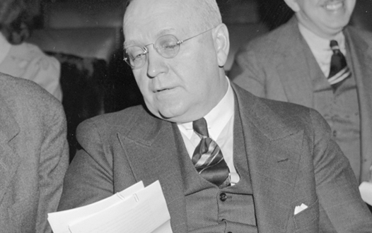 Harold Glenn Moulton reviewing some documents