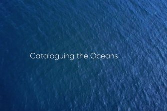 Ocean waters viewed overhead, with the text Cataloguing the Oceans