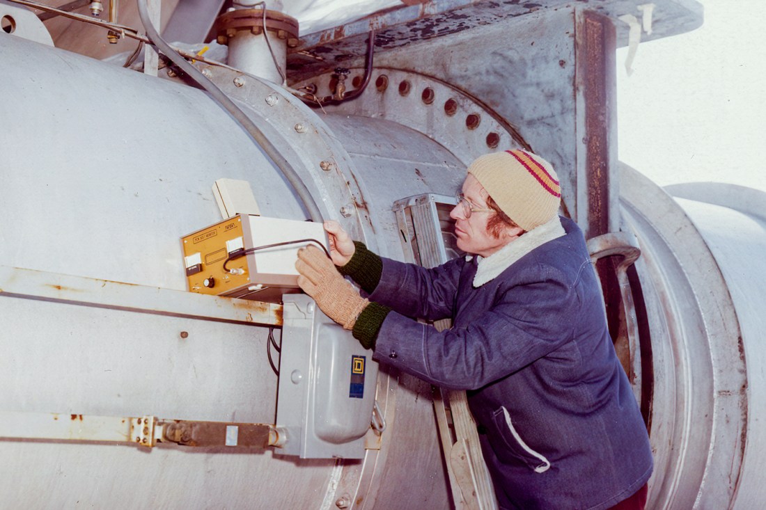 Heyman working on the outside of the wind tunnel