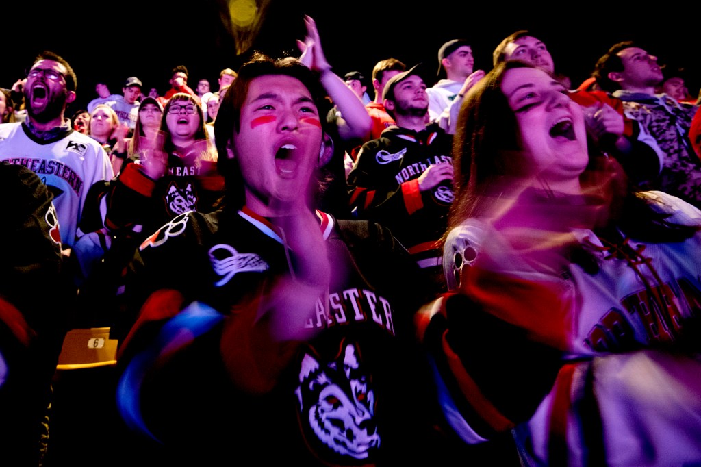 Students cheering in the fan section at the Beanpot